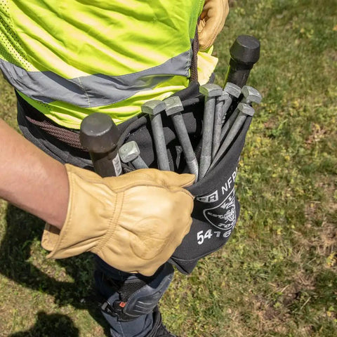 Person wearing Flame Resistant No 4 Canvas Tool Bag For Bolt Storage With Tunnel Belt Loop And Double Reinforced Bottom