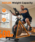 Man using Magnetic Indoor Exercise Bike With Exclusive App, 400 Lb Weight Capacity, in home setting