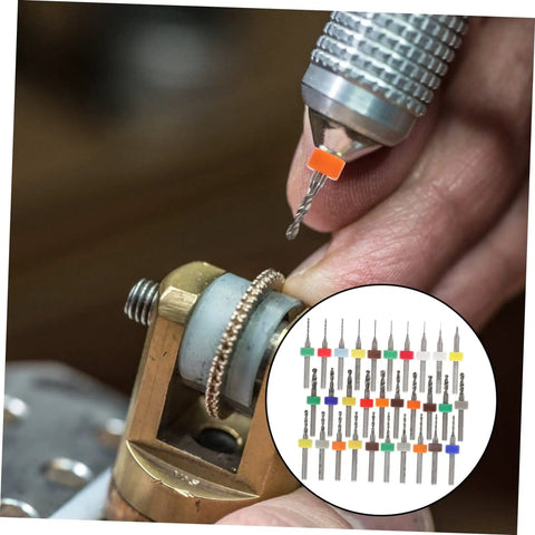 Close-up of hand using 30 Piece Tungsten PCB Drill Bit Set for Hand Drill and Jewelry Making, bits displayed in insert.