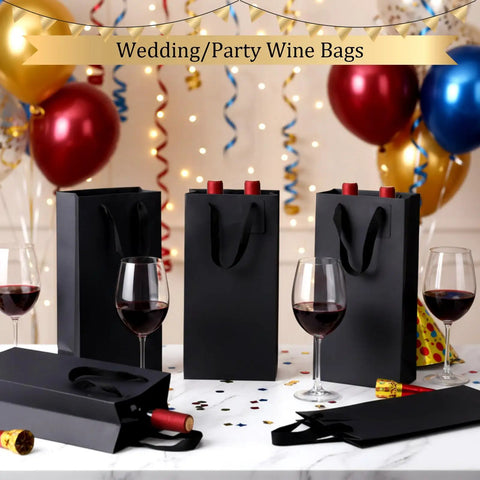 100 Pack Durable Black Paper Wine Carry Bags For Two Bottles Premium Gift Carriers With Free Labels at a festive party table.