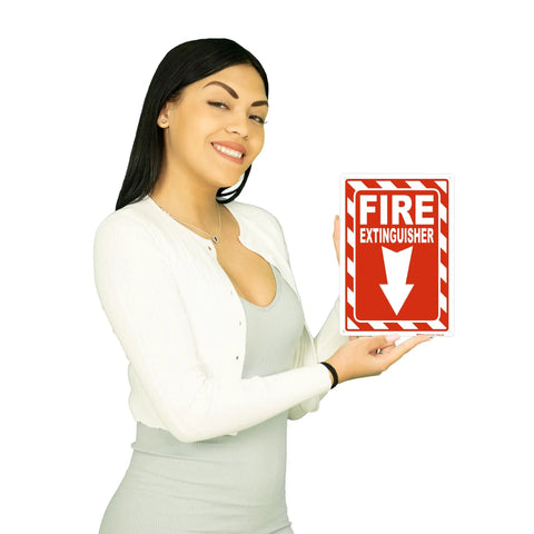 Woman holding 7 Inch By 10 Inch Fire Extinguisher Sign Made From Rust Free Aluminum With Bold Text And Symbol for visibility