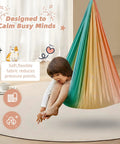 Child in a Heavy Duty Straight Up Smooth Sensory Swing For Kids And Adults Indoor Outdoor Cuddle Hammock Chair, relaxing.
