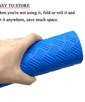 Hand holding rolled Blue 36 Inch By 9 Inch Non Slip Pool Ladder Pad Mat With Protective Cushion Between Ladder Base And Pool Liner