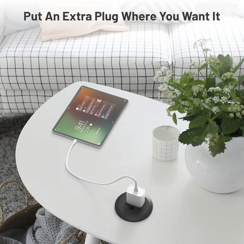 2 Inch Flush Mount Desk Power Grommet With Built In US Outlet And 3.28 Ft Heavy Duty Cord, installed on a white table with tablet.