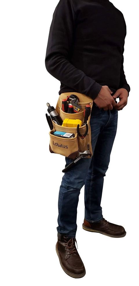 Person wearing Genuine Suede Leather Tool Pouch Bag With 2 Hammer Holders And 10 Pockets For Carpenters Construction Framers And Handymen Fits Up To Two And A Half Inch Tool Belts filled with tools.