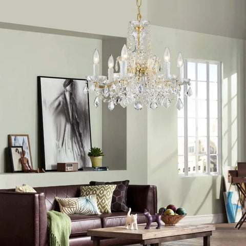 Modern Crystal Chandelier Light Fixture With Six Lights, Raindrop Pendant Crystals In Maria Theresa Brass Finish in living room