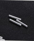 Close-up of metal shafts from 40 Piece DIY Robot Drive Shaft Kit For RC Robots Short Axle Steering Gears Metal Build Upgrade Dope For Custom Robo Projects Durable High Strength Metal Shafts Perfect For Hobbyists, Builders, And RC Robotic Creations