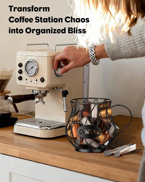 K Cup Holder With Ice Tongs And Large Capacity Coffee Pod Organizer For 10 To 30 Pods Metal Wire K Cup Stand on countertop next to espresso machine.