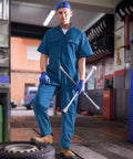 Mens Short Sleeve Coveralls Shop Grade Mechanic Jumpsuit With Deep Utility Pockets Rugged Cotton Poly Blend in blue, in garage setting.