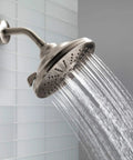 3 Spray Touch-Clean Shower Head In Venetian Bronze Finish, High-Pressure Full-Body Sprays flowing in modern bathroom