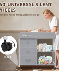 Must Have Portable Baby Changing Table With Waterproof Pad And Diaper Station Dresser Style Organizer showing a mother using the table with baby essentials displayed.