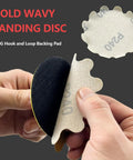 Person holding 3-inch hook and loop sanding disc, showing backing and P240 grit, part of 80 Pack 3 Inch Hook And Loop Sanding Discs Wet And Dry Flex Edge Pads With Grits 60 80 120 150 180 240 400 800 For Sanders And Hand Drills Ideal For Metal Wood Auto Projects And Fine Finishing.
