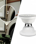 Magnetic Door Catch For RV Camper Caravan Motorhome And Boat, installed on RV, white finish, close-up view.