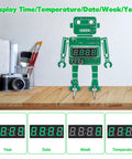 Alarm Clock Soldering Practice Kit For Students And Makers Build Your Own 4 Digit Robot Digital Clock With Temperature Display And STEM Circuit Board Project For Classroom Or Desk on a wooden desk with digital display features visible.