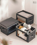 Dark Grey 3 Pack Fabric Storage Bins With Lid And Peek Window Collapsible Closet Organizers Tough Handle crates filled with toys and blankets.