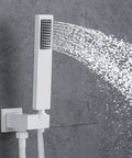Digital Display Rainfall Shower Faucet Set With Real Time Temperature Reading Oversized Ceiling Rainhead Plus Ergonomic Handheld Wand modern handheld wand in white with water spray, mounted on a wall.