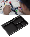 Magnetic RC Parts Tray Portable Aluminum Alloy Repair Tray with Magnetic Screw Holder Plate used for RC car repairs.