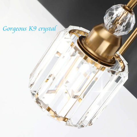 Close-up of crystal lamp on Three Light Black Metal And Crystal Vanity Light Fixture For Modern Bathrooms, gold details visible.