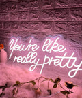 You Are Like Really Pretty Neon Light Sign Peach Pink LED Neon Wall Decor for Bedroom, pink script against brick wall
