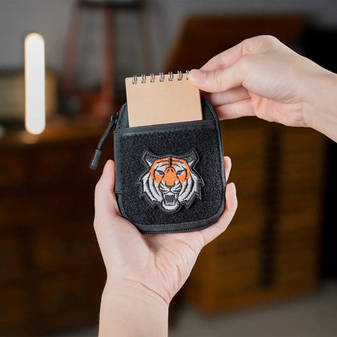 Person holding Dope EDC Pouch for Men, Pocket Organizer with tiger patch showing notebook insertion.