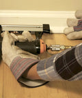 Person using Pro Grade Pneumatic 20 Gauge L Cleat Flooring Nailer for tongue and groove hardwood installs on floor