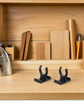 Heavy Duty Adjustable Plinth Leg Clips 12 Pack No Sweat Cabinet Leveler Hardware For Kitchen Cabinets Tables And Chairs on wooden desk.