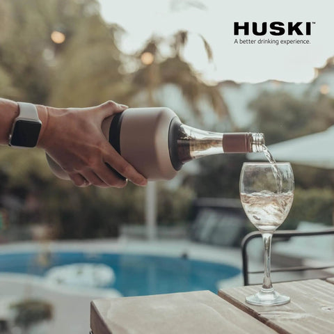 Pouring wine from Next Gen Iceless Wine Chiller Keeps Your Bottle Cold Up To 6 Hours No Ice Needed Fits Champagne Bottles All Stainless Steel