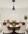Vintage Glass Pendant Light Kitchen Island with Walnut Wood 9.8in above a round dining table in a bright room.