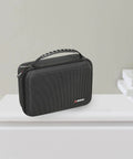 Hard Carrying Case For MC-101 And TR-6S Compact Music Production Station shown on table, beefy shell, secure latches, black case.