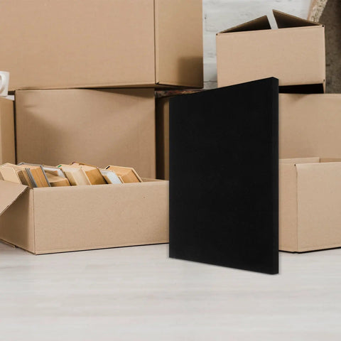 Polyurethane Foam Padding Pack Cut To Size Four Pieces Black Shockproof Protection for Packaging in front of cardboard boxes