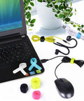 Twenty Pack Reusable Cable Organizer Ties for Earbuds Headphones Chargers and Cables 3 Sizes Assorted Colors in use on laptop desk
