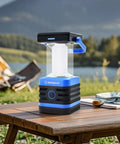 Go-To Solar Rechargeable Lantern For Camping And Hiking, 1000 Lumen LED Light with 5 Modes on wooden table by lake campsite