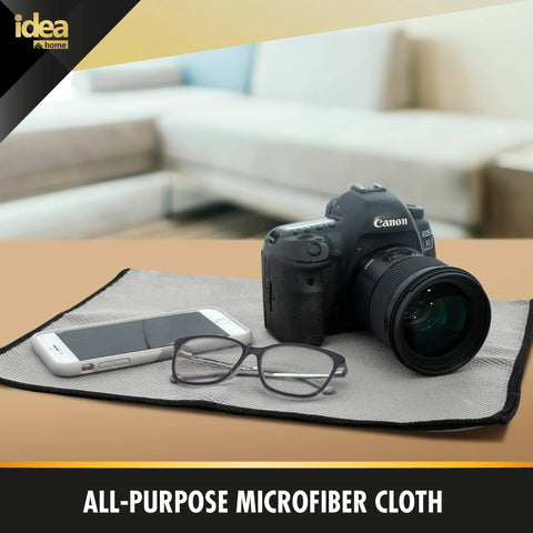 Idea Home microfiber cleaning cloth, gray with black edge, 16x24 in, shown under a camera with a smartphone and glasses.