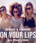 Three smiling women at the beach advertising Sweet Watermelon Lip Balm Trio, Peaches And Cream Lip Balm, Pink Lemonade Lip Balm.