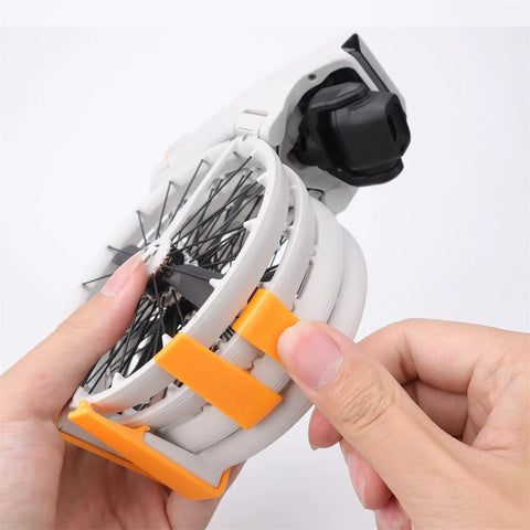 Person adjusting Ultra Light Drone Landing Gear Extension Kit for DJI Flip Quick Release 2.6cm Height Boost with durable 3D printed design