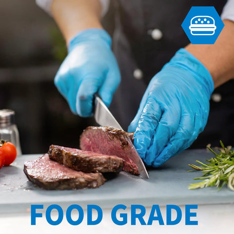 Blue nitrile disposable gloves being used to slice beef on a cutting board.