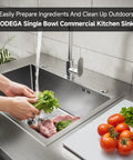 Person using Stainless Steel Outdoor Kitchen Sink with Faucet Kit Hose Hookups Single Bowl Storage Brakes On Wheels Spice Rack All Weather Use Built To Last For RV Yard Garage Restaurants.