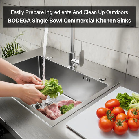Person using Stainless Steel Outdoor Kitchen Sink with Faucet Kit Hose Hookups Single Bowl Storage Brakes On Wheels Spice Rack All Weather Use Built To Last For RV Yard Garage Restaurants.