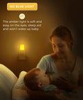 Amber Night Light With Dusk To Dawn Sensor Dimmable Plug In LED Night Light For Kids, glowing softly in dimly lit room.