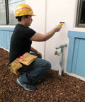 Person using MetalliScanner M40 Handheld Electronic Metal Detector For Drywall Concrete Lathe And Plaster Stucco near outside wall.