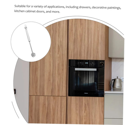 soft close cabinet hinge shown on a wooden kitchen cabinet