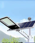 Outdoor Solar Security Flood Light With Remote And Dusk To Dawn Sensor Super Bright Led Yard Lighting mounted with solar panel under clear sky.