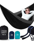 Durable Nylon Camping Hammock For Outdoors, Ultra Portable Tree Hammock, man relaxing in single size black hammock with accessories shown