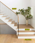 Watch Your Step Sign 5 Pack Budget Friendly Self Adhesive Floor Decals on white stair steps and hallway