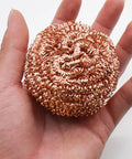 Top Grade Solder Tip Cleaning Brush Made With Heavy Duty Wire Sponge For High Temp Irons held in hand, showcasing its copper steel material.