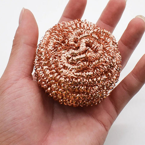Top Grade Solder Tip Cleaning Brush Made With Heavy Duty Wire Sponge For High Temp Irons held in hand, showcasing its copper steel material.