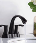 Solid Brass 4 Inch Centerset Bathroom Faucet With Two Handles And Drain Assembly Lead Free And ADA Compliant Bronze Gold Finish No Drip Water Saving Vanity Sink Tap For Modern Bathrooms, installed on a white counter with water flowing.
