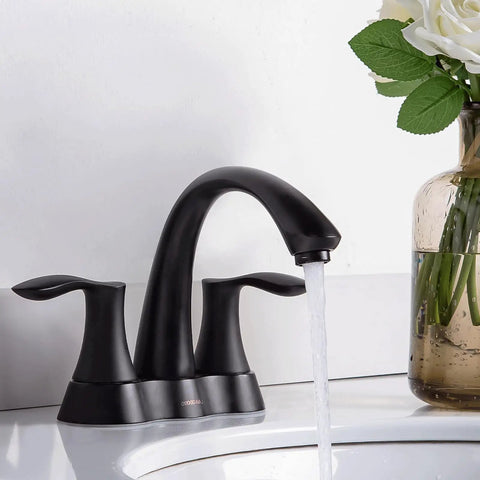 Solid Brass 4 Inch Centerset Bathroom Faucet With Two Handles And Drain Assembly Lead Free And ADA Compliant Bronze Gold Finish No Drip Water Saving Vanity Sink Tap For Modern Bathrooms, installed on a white counter with water flowing.