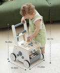 Dad Approved Solid Wood Toddler Walker Tool Table With Interactive Building Blocks Realistic Hammer Wrench Gear Station For Growing Hands And Brainy Play Light Gray, toddler engaged with walker.