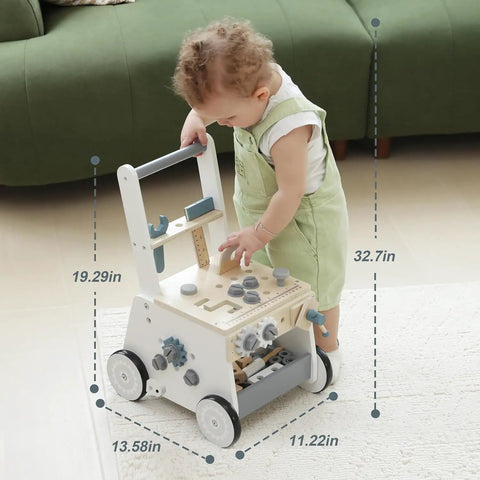 Dad Approved Solid Wood Toddler Walker Tool Table With Interactive Building Blocks Realistic Hammer Wrench Gear Station For Growing Hands And Brainy Play Light Gray, toddler engaged with walker.